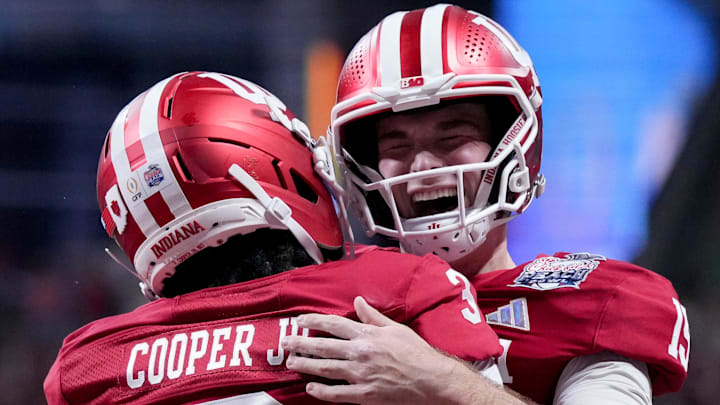 Indiana Hoosiers quarterback Fernando Mendoza (15) celebrates with Indiana Hoosiers wide receiver Omar Cooper Jr. (3) celebrate after connecting for a touchdown Friday, Jan. 9, 2026, during the Peach Bowl and semifinal game of the College Football Playoff against the Oregon Ducks at Mercedes-Benz Stadium in Atlanta.