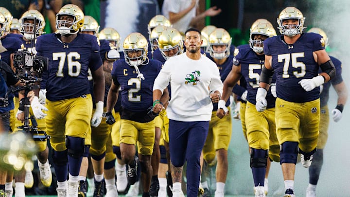 Notre Dame head coach Marcus Freeman takes the field with his team before a NCAA football game against Texas A&M at Notre Dame Stadium on Saturday, Sept. 13, 2025, in South Bend.