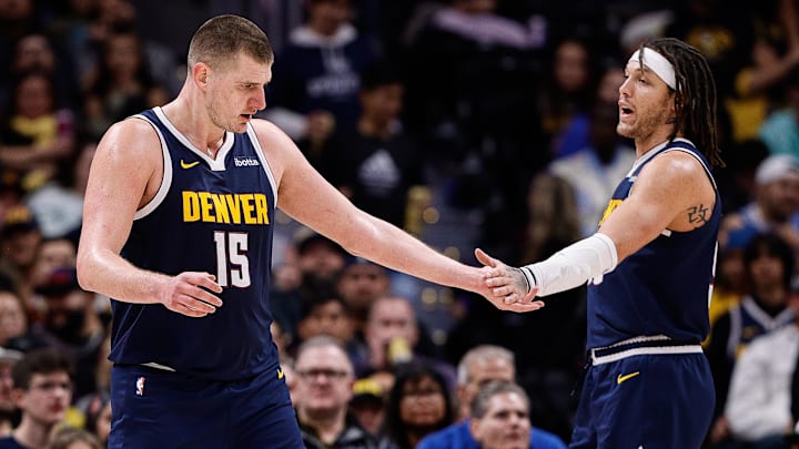 Denver Nuggets center Nikola Jokic (15) reacts with forward Aaron Gordon (50) in the second quarter against the Brooklyn Nets at Ball Arena. Mandatory Credit: Isaiah J. Downing-Imagn Images