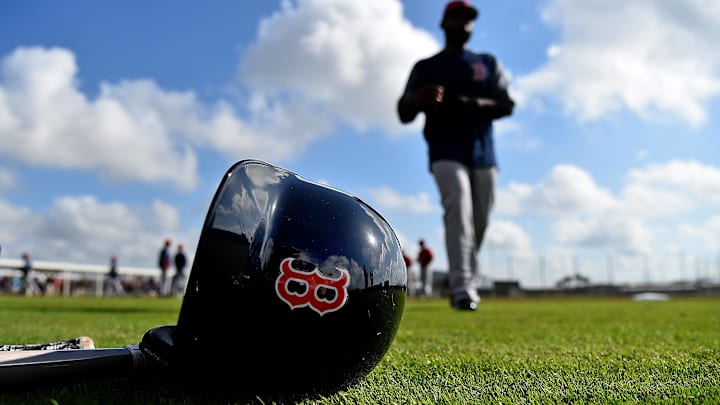 Feb 18, 2019; Lee County, FL, USA; A general view of a Boston Red Sox helmet as Boston Red Sox center fielder Jackie Bradley Jr. (19) walks on the field during a spring training workout at Jet Blue Park at Fenway South. Mandatory Credit: Jasen Vinlove-Imagn Images