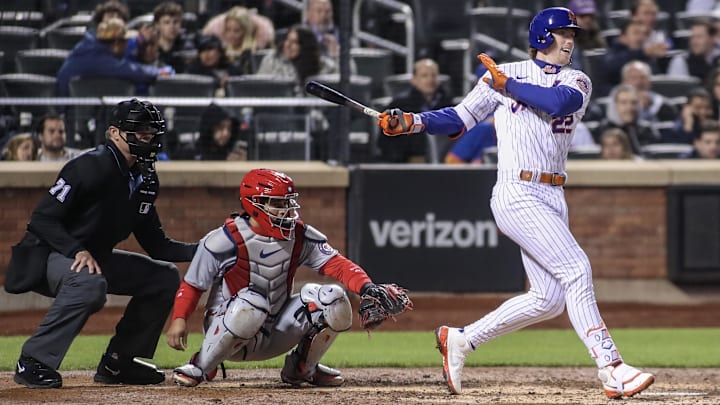 Apr 27, 2023; New York City, New York, USA; New York Mets third baseman Brett Baty (22) hits a single in the fifth inning against the Washington Nationals at Citi Field.
