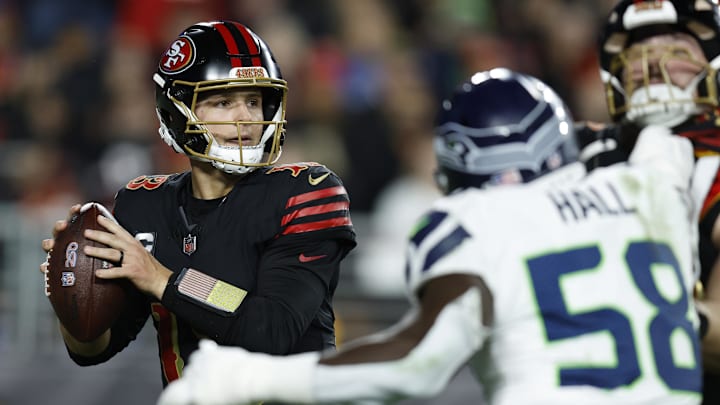 Jan 3, 2026; Santa Clara, California, USA; San Francisco 49ers quarterback Brock Purdy (13) drops back to pass against the Seattle Seahawks during the second half at Levi's Stadium. Mandatory Credit: Sergio Estrada-Imagn Images