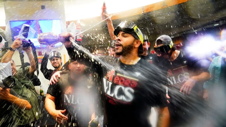 Oct 11, 2023; Phoenix, AZ, USA; Arizona Diamondbacks Tommy Pham sprays champagne during clubhouse celebrations after sweeping the Los Angeles Dodgers 3-0 to win the NLDS at Chase Field. Mandatory Credit: Rob Schumacher-Arizona Republic