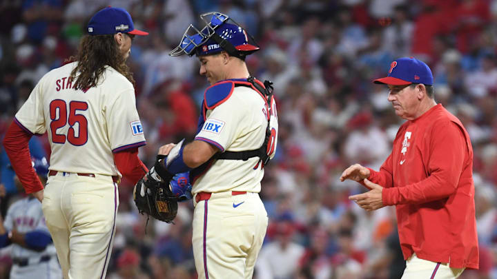 Oct 5, 2024; Philadelphia, PA, USA; Philadelphia Phillies manager Rob Thomson makes a pitching change against the New York Mets in the eighth inning in game one of the NLDS for the 2024 MLB Playoffs at Citizens Bank Park.
