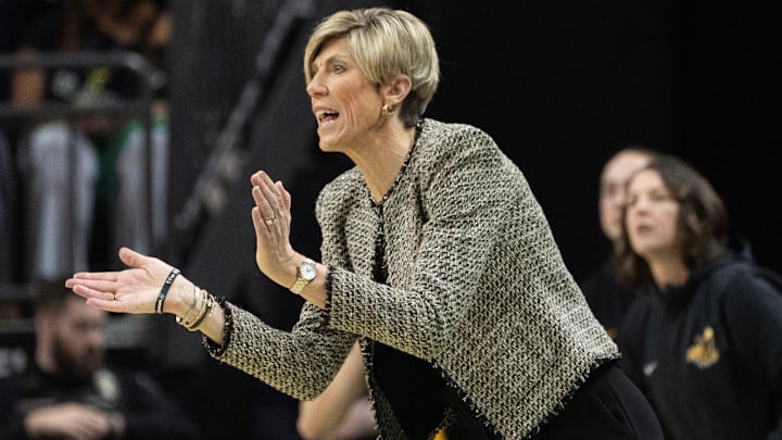 Iowa coach Jan Jensen cheers on her team against Oregon at Matthew Knight Arena Sunday, Jan. 19, 2025.