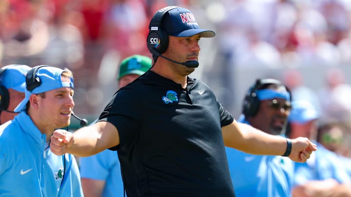 Sep 14, 2024; Norman, Oklahoma, USA; Tulane Green Wave head coach Jon Sumrall reacts during the first half against the Oklahoma Sooners at Gaylord Family-Oklahoma Memorial Stadium. Sep 14, 2024; Norman, Oklahoma, USA; Tulane Green Wave head coach Jon Sumrall reacts during the first half against the Oklahoma Sooners at Gaylord Family-Oklahoma Memorial Stadium.