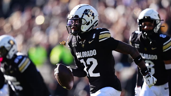 Nov 29, 2024; Boulder, Colorado, USA; Colorado Buffaloes cornerback Travis Hunter (12) following an interception in the first quarter against the Oklahoma State Cowboys  at Folsom Field.