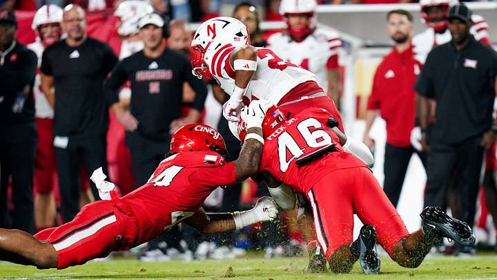Cincinnati Bearcats defensive back Antwan Peek Jr. (46) tackles Nebraska Cornhuskers running back Isaiah Mozee (22) in the second quarter of a NCAA college football season opening game between the Cincinnati Bearcats and Nebraska Cornhuskers, Aug. 28, 2025, at Arrowhead Stadium in Kansas City, Mo. Cincinnati Bearcats defensive back Antwan Peek Jr. (46) tackles Nebraska Cornhuskers running back Isaiah Mozee (22) in the second quarter of a NCAA college football season opening game between the Cincinnati Bearcats and Nebraska Cornhuskers, Aug. 28, 2025, at Arrowhead Stadium in Kansas City, Mo.