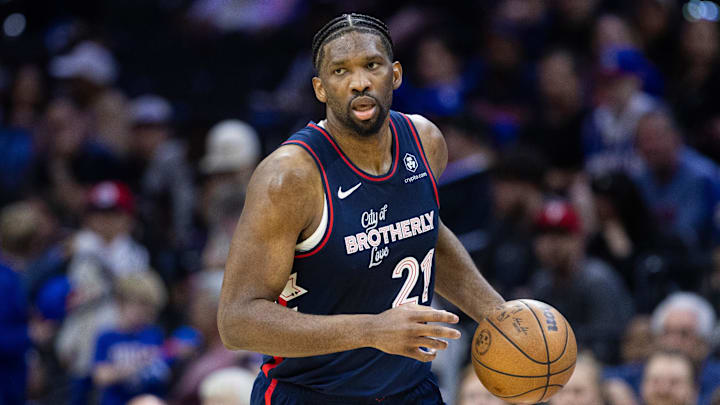 Apr 9, 2024; Philadelphia, Pennsylvania, USA; Philadelphia 76ers center Joel Embiid (21) dribbles against Detroit. 