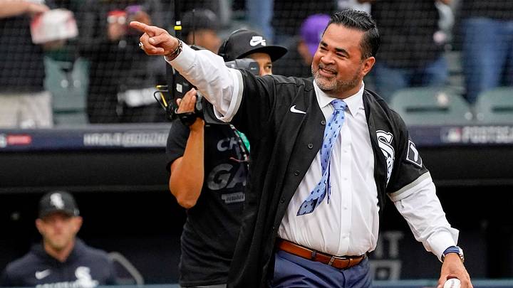 Oct 12, 2021; Chicago, Illinois, USA; Former Chicago White Sox player and manager Ozzie Guillen acknowledges the crowd as he walks onto the field before throwing a ceremonial first pitch before game four of the 2021 ALDS between the Chicago White Sox and the Houston Astros at Guaranteed Rate Field. Mandatory Credit: David Banks-USA TODAY Sports