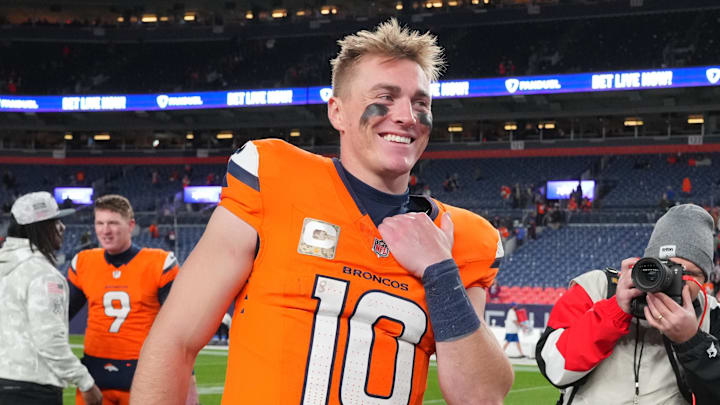 Nov 17, 2024; Denver, Colorado, USA; Denver Broncos quarterback Bo Nix (10) reacts following the win over the Atlanta Falcons at Empower Field at Mile High. Mandatory Credit: Ron Chenoy-Imagn Images