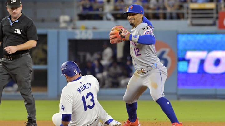 Oct 20, 2024; Los Angeles, California, USA; Los Angeles Dodgers first baseman Max Muncy (13) is out at second against New York Mets shortstop Francisco Lindor (12) in the seventh inning during game six of the NLCS for the 2024 MLB playoffs at Dodger Stadium. Mandatory Credit: Jayne Kamin-Oncea-Imagn Images Oct 20, 2024; Los Angeles, California, USA; Los Angeles Dodgers first baseman Max Muncy (13) is out at second against New York Mets shortstop Francisco Lindor (12) in the seventh inning during game six of the NLCS for the 2024 MLB playoffs at Dodger Stadium. Mandatory Credit: Jayne Kamin-Oncea-Imagn Images