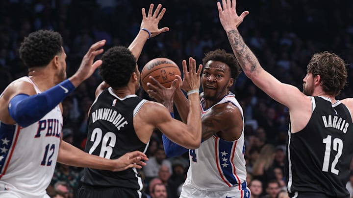 Apr 22, 2023; Brooklyn, New York, USA; Philadelphia 76ers forward Paul Reed (44) goes to the basket as Brooklyn Nets guard Spencer Dinwiddie (26) and forward Joe Harris (12) defend in front of forward Tobias Harris (12) during the second quarter of game four of the 2023 NBA playoffs at Barclays Center. Mandatory Credit: Vincent Carchietta-Imagn Images