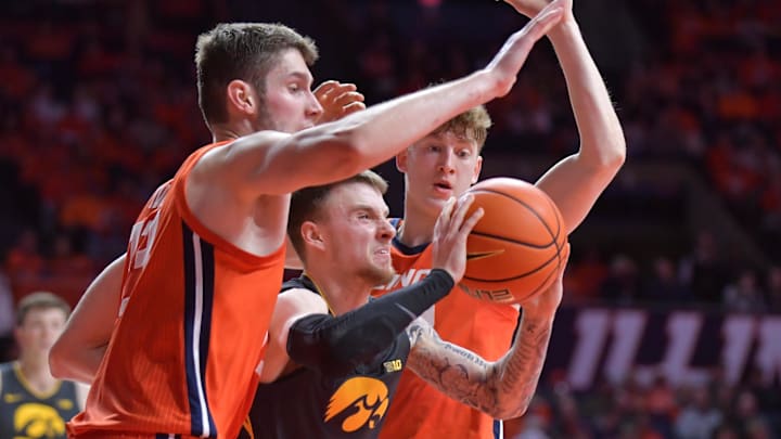 Feb 25, 2025; Champaign, Illinois, USA;  Illinois Fighting Illini center Tomislav Ivisic (13) and  Kasparas Jakucionis pressure Iowa Hawkeyes guard Brock Harding (2) during the second half at State Farm Center. Mandatory Credit: Ron Johnson-Imagn Images