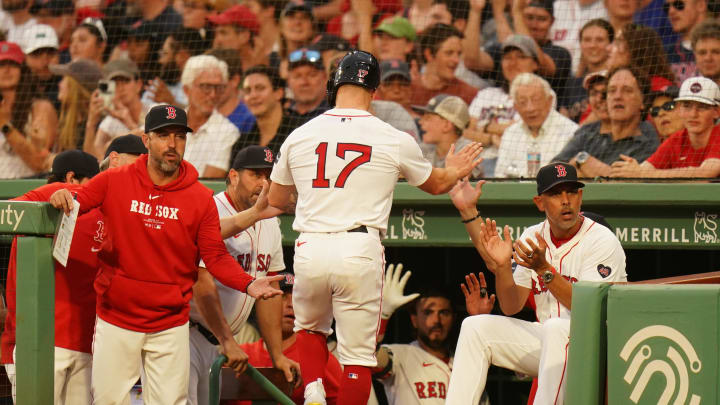 Jul 9, 2024; Boston, Massachusetts, USA; Boston Red Sox left fielder Tyler O'Neill (17) is congratulated after scoring against the Oakland Athletics in the first inning at Fenway Park. Mandatory Credit: David Butler II-USA TODAY Sports