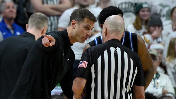 Dec 6, 2025; East Lansing, Michigan, USA; Duke Blue Devils head coach Jon Scheyer protests a call during the first half against the Michigan State Spartans at Jack Breslin Student Events Center. Mandatory Credit: Dale Young-Imagn Images Dec 6, 2025; East Lansing, Michigan, USA; Duke Blue Devils head coach Jon Scheyer protests a call during the first half against the Michigan State Spartans at Jack Breslin Student Events Center. Mandatory Credit: Dale Young-Imagn Images
