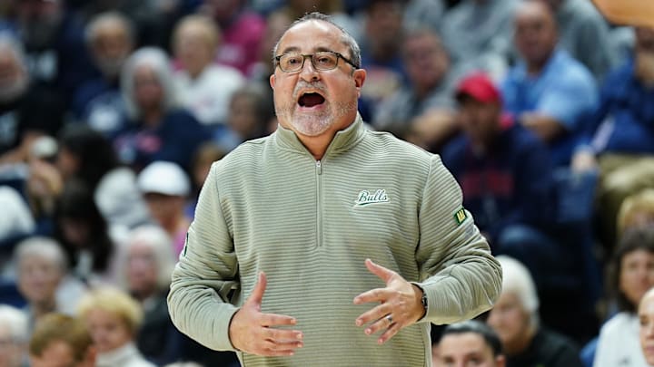 Nov 10, 2024; Storrs, Connecticut, USA; South Florida Bulls head coach Jose Fernandez watches from the sideline as they take on the UConn Huskies at Harry A. Gampel Pavilion. Mandatory Credit: David Butler II-Imagn Images