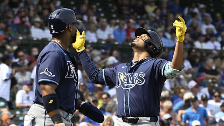 Sep 12, 2025; Chicago, Illinois, USA;  Tampa Bay Rays designated hitter Christopher Morel (25) raises his arms after hitting  a three run home run against the Chicago Cubs during the first inning at Wrigley Field. Mandatory Credit: Matt Marton-Imagn Images