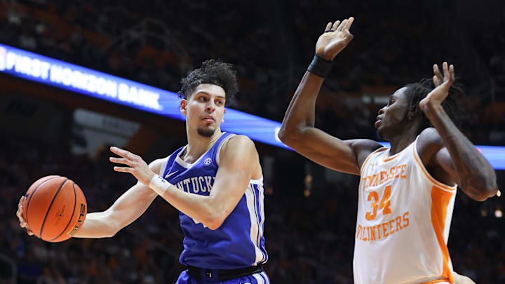 Jan 28, 2025; Knoxville, Tennessee, USA; Kentucky Wildcats guard Koby Brea (4) passes the ball against Tennessee Volunteers forward Felix Okpara (34) during the second half at Thompson-Boling Arena at Food City Center. Mandatory Credit: Randy Sartin-Imagn Images