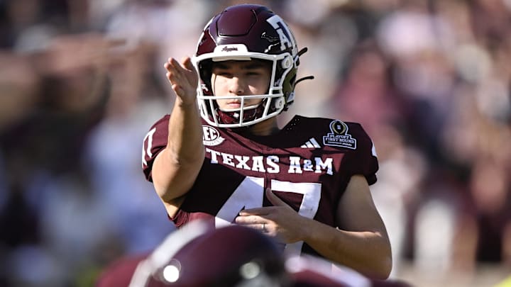 Texas A&M Aggies kicker Randy Bond lines up a field goal against the Miami Hurricanes during the second half of the first round game of the CFP National Playoff at Kyle Field. 