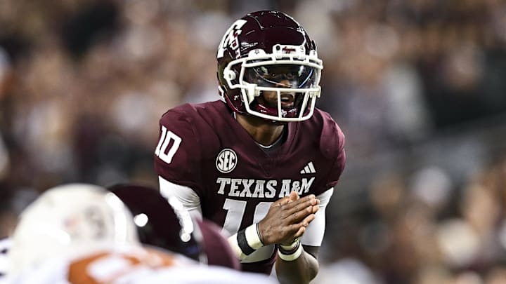 Nov 30, 2024; College Station, Texas, USA; Texas A&M Aggies quarterback Marcel Reed (10) calls a play during the first quarter against the Texas Longhorns. The Longhorns defeated the Aggies 17-7 at Kyle Field. Mandatory Credit: Maria Lysaker-Imagn Images  