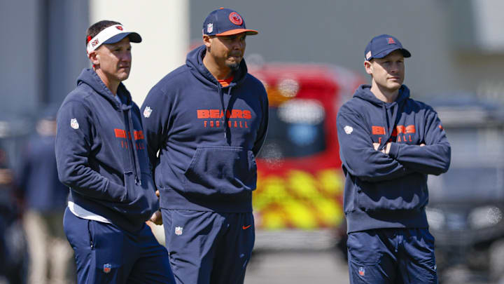 May 9, 2025; Lake Forest, IL, USA; Chicago Bears defensive coordinator Dennis Allen (L), general manager Ryan Poles (C) and head coach Ben Johnson (R) observe during the Rookie Minicamp at Halas Hall. Mandatory Credit: Kamil Krzaczynski-Imagn Images