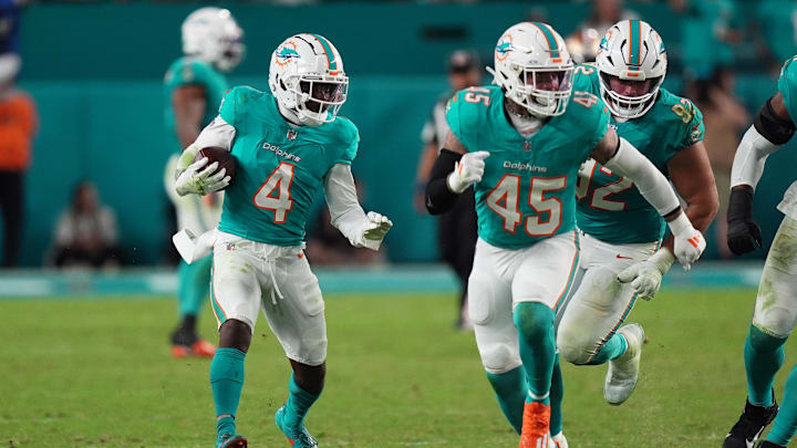 Miami Dolphins cornerback Kader Kohou (4) runs with the ball after intercepting a pass from San Francisco 49ers quarterback Brock Purdy (13, not pictured) during second half at Hard Rock Stadium. 