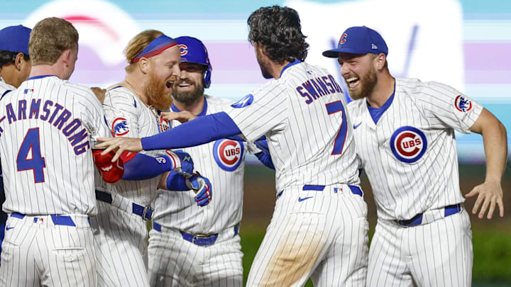 May 13, 2025; Chicago, Illinois, USA; Chicago Cubs first baseman Justin Turner (3) celebrates with teammates after hitting a walk-off two-run double against the Miami Marlins during the ninth inning at Wrigley Field. May 13, 2025; Chicago, Illinois, USA; Chicago Cubs first baseman Justin Turner (3) celebrates with teammates after hitting a walk-off two-run double against the Miami Marlins during the ninth inning at Wrigley Field.
