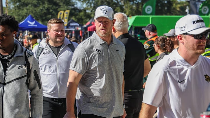 Nov 22, 2025; Orlando, Florida, USA; UCF Knights head coach Scott Frost walks into the venue before the game against the Oklahoma State Cowboys at Acrisure Bounce House. Mandatory Credit: Mike Watters-Imagn Images