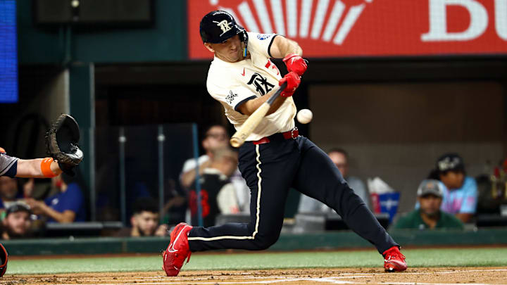 Sep 5, 2025; Arlington, Texas, USA;  Texas Rangers left fielder Wyatt Langford (36) hits a double during the first inning against the Houston Astros at Globe Life Field. Mandatory Credit: Kevin Jairaj-Imagn Images