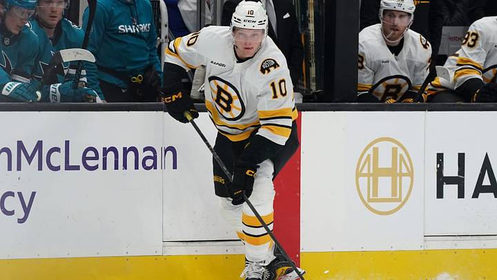 Nov 23, 2025; San Jose, California, USA;  Boston Bruins left winger Riley Tufte (10) passes the puck during a game against the San Jose Sharks in the first period at SAP Center in San Jose. Mandatory Credit: David Gonzales-Imagn Images