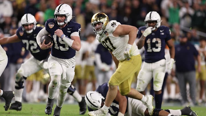 Penn State Nittany Lions quarterback Drew Allar (15) runs the ball in the second half against the Notre Dame Fighting Irish in the Orange Bowl at Hard Rock Stadium. 