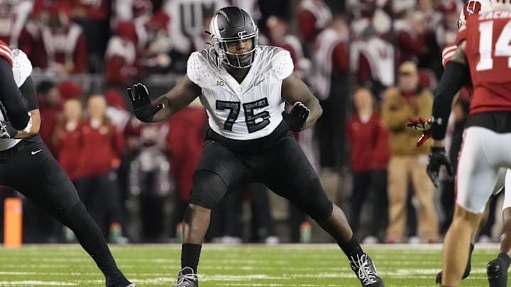 Nov 16, 2024; Madison, Wisconsin, USA;  Oregon Ducks offensive linenam Josh Conerly Jr. (76) during the game against the Wisconsin Badgers at Camp Randall Stadium. Mandatory Credit: Jeff Hanisch-Imagn Images