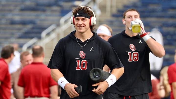 Oklahoma quarterback John Mateer hits the field at The Big House to warm up before Saturday's contest between the No. 11 Sooners and Michigan.