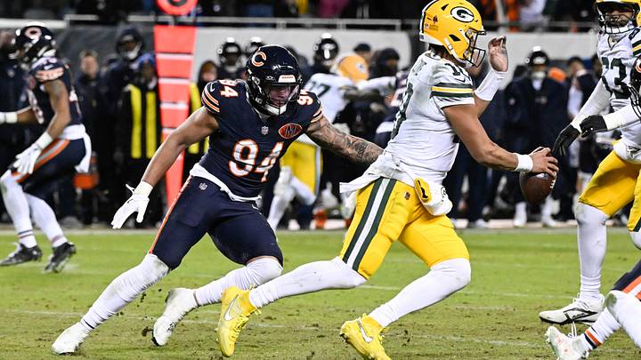 Bears defensive end Austin Booker pressures Packers quarterback Jordan Love during last season's wild-card playoff game. Bears defensive end Austin Booker pressures Packers quarterback Jordan Love during last season's wild-card playoff game.