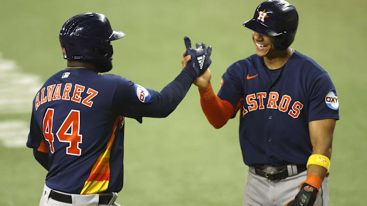 Sep 5, 2023; Arlington, Texas, USA; Houston Astros designated hitter Yordan Alvarez (44) and shortstop Jeremy Pena (3) celebrate a two-run home run in the seventh inning against the Texas Rangers  at Globe Life Field. 