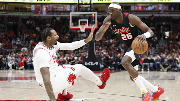 Mar 18, 2024; Chicago, Illinois, USA; Portland Trail Blazers center Duop Reath (26) drives to the basket against the Chicago Bulls during the second half at United Center. Mandatory Credit: Kamil Krzaczynski-Imagn Images
