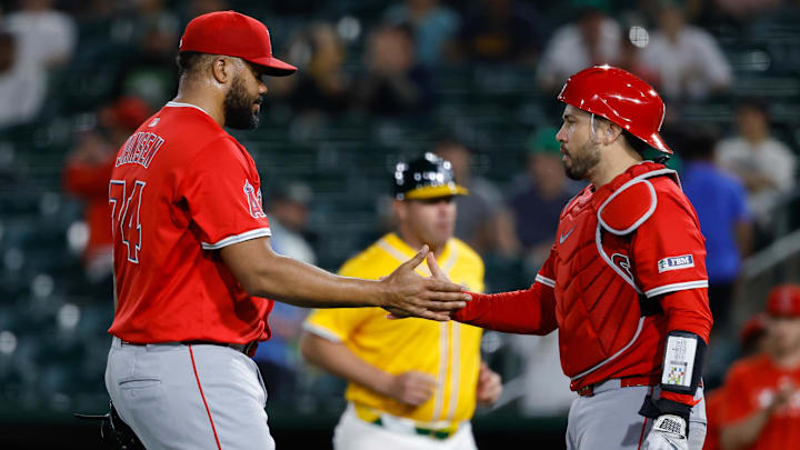 May 20, 2025; West Sacramento, California, USA; Los Angeles Angels pitcher Kenley Jansen (74) and catcher Travis d'Arnaud (25) shake hands after the game against the Athletics at Sutter Health Park. Mandatory Credit: Sergio Estrada-Imagn Images