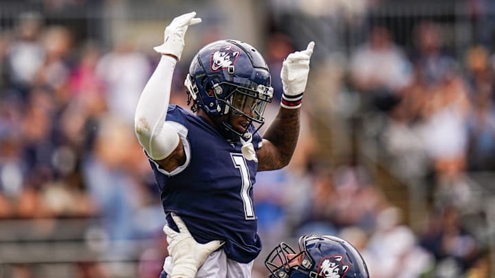 Sep 28, 2024; East Hartford, Connecticut, USA; Connecticut Huskies wide receiver Skyler Bell (1) celebrates after his touchdown against the Buffalo Bulls in the second half