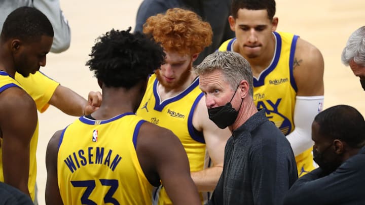 Mar 4, 2021; Phoenix, Arizona, USA; Golden State Warriors head coach Steve Kerr (right) talks with center James Wiseman (33) in the huddle against the Phoenix Suns in the second half at Phoenix Suns Arena. Mandatory Credit: Mark J. Rebilas-Imagn Images
