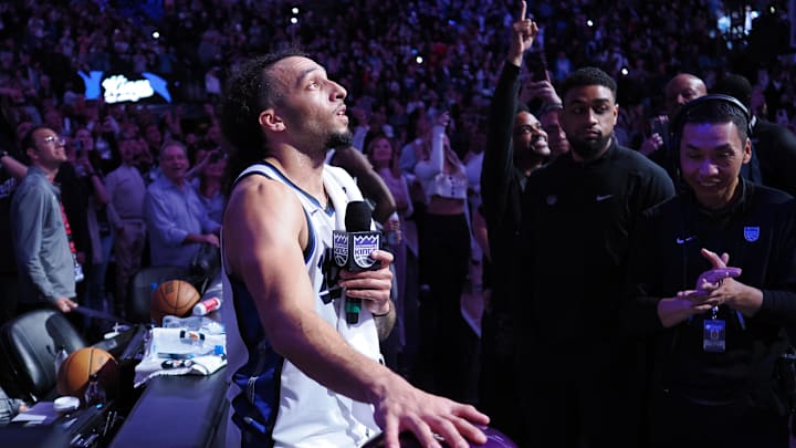 Mar 19, 2025; Sacramento, California, USA; Sacramento Kings guard Devin Carter (22) lights the beam after a win against the Cleveland Cavaliers at Golden 1 Center. Mandatory Credit: Kelley L Cox-Imagn Images