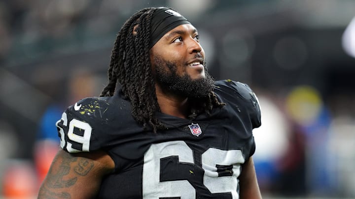 Dec 14, 2023; Paradise, Nevada, USA;  Las Vegas Raiders defensive tackle Adam Butler (69) smiles after the game against the Los Angeles Chargers at Allegiant Stadium. Mandatory Credit: Stephen R. Sylvanie-Imagn Images