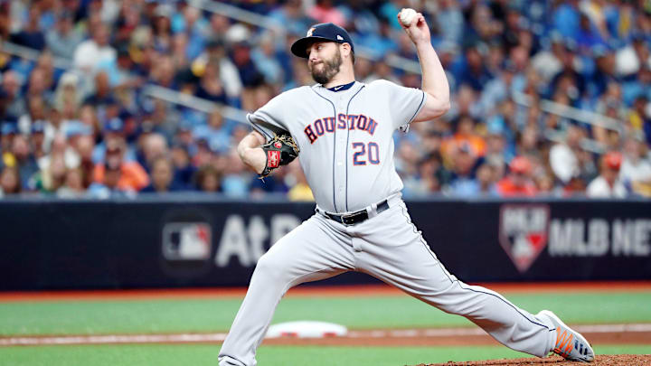 Oct 7, 2019; St. Petersburg, FL, USA; Houston Astros starting pitcher Wade Miley (20) pitches against the Tampa Bay Rays during the fourth inning in game three of the 2019 ALDS playoff baseball series at Tropicana Field. Mandatory Credit: Kim Klement-Imagn Images