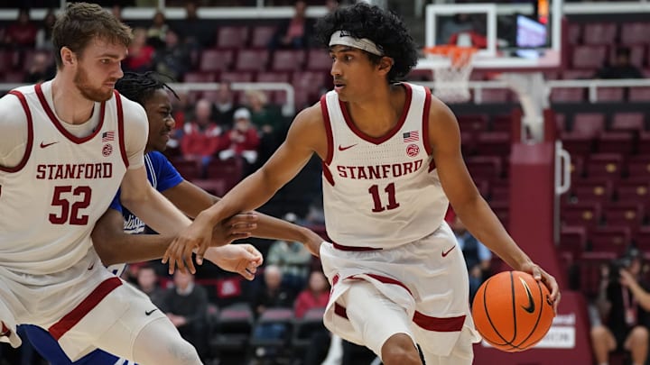 Dec 17, 2025; Stanford, California, USA;  Stanford Cardinal guard Ryan Agarwal (11) runs around a screen from  forward/center Aidan Cammann (52) against Texas-Arlington Mavericks guard Bahsil Laster (8) in the first half at Maples Pavilion. Mandatory Credit: David Gonzales-Imagn Images