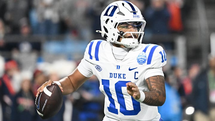 Dec 6, 2025; Charlotte, NC, USA; Duke Blue Devils quarterback Darian Mensah (10) looks to throw in the second quarter against the Virginia Cavaliers during the 2025 ACC Championship game at Bank of America Stadium. Mandatory Credit: Bob Donnan-Imagn Images
