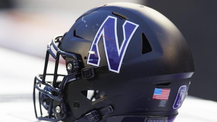 Nov 11, 2023; Madison, Wisconsin, USA;  General view of a Northwestern Wildcats helmet on the sidelines during the game against the Wisconsin Badgers at Camp Randall Stadium. Mandatory Credit: Jeff Hanisch-Imagn Images