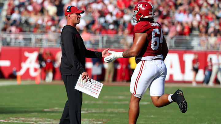Nov 22, 2025; Tuscaloosa, Alabama, USA; Alabama Crimson Tide head coach Kalen DeBoer high fives Alabama Crimson Tide offensive lineman Michael Carroll (64) during the first half against the Eastern Illinois Panthers at Saban Field at Bryant-Denny Stadium. Mandatory Credit: David Leong-Imagn Images