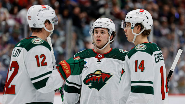 Apr 9, 2024; Denver, Colorado, USA; Minnesota Wild defenseman Brock Faber (7) and left wing Matt Boldy (12) and center Joel Eriksson Ek (14) in the first period against the Colorado Avalanche at Ball Arena. Mandatory Credit: Isaiah J. Downing-Imagn Images