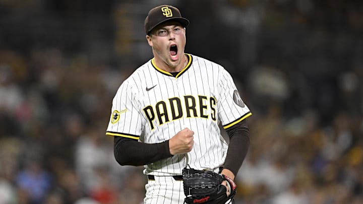 Sep 9, 2025; San Diego, California, USA; San Diego Padres relief pitcher Mason Miller (22) celebrates after striking out a batter during the eighth inning against the Cincinnati Reds at Petco Park. Mandatory Credit: Denis Poroy-Imagn Images