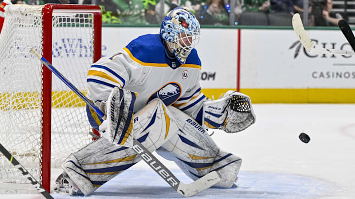 Apr 9, 2024; Dallas, Texas, USA; Buffalo Sabres goaltender Ukko-Pekka Luukkonen (1) makes a glove save against the Dallas Stars during the second period at the American Airlines Center. Mandatory Credit: Jerome Miron-Imagn Images